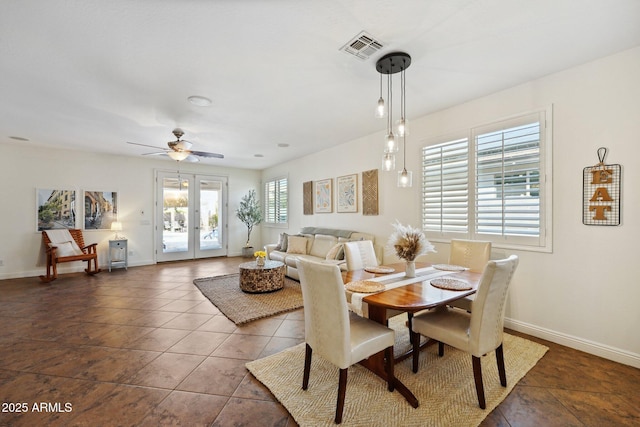 dining room featuring french doors, visible vents, ceiling fan, tile patterned flooring, and baseboards