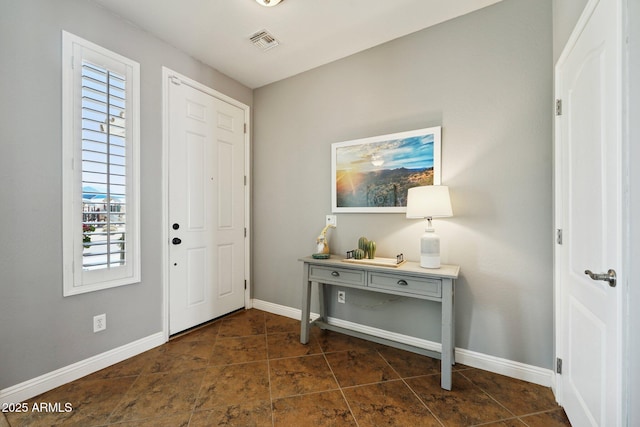 foyer featuring visible vents and baseboards