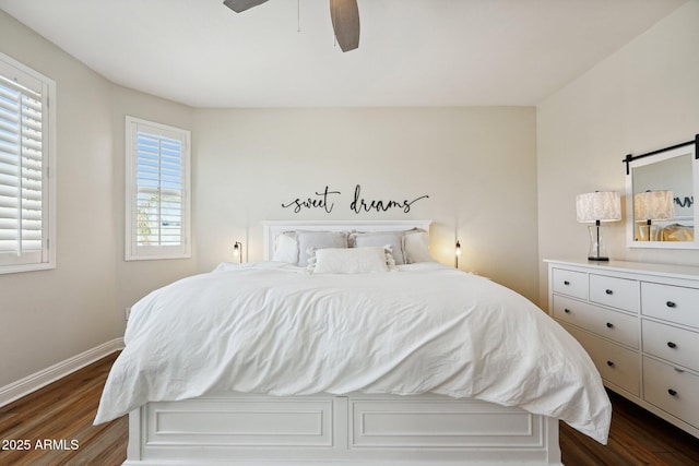 bedroom featuring ceiling fan, baseboards, and dark wood-type flooring