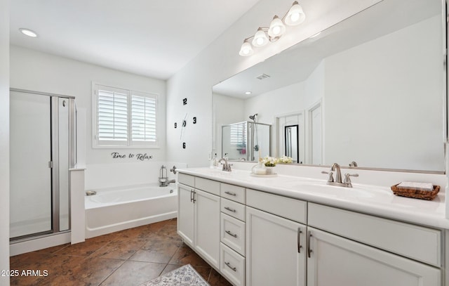 bathroom featuring a sink, visible vents, a bath, double vanity, and a stall shower