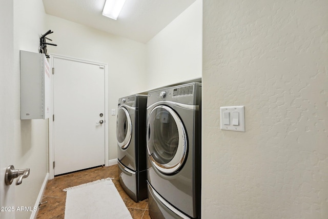 laundry room featuring washer and dryer, laundry area, and tile patterned floors