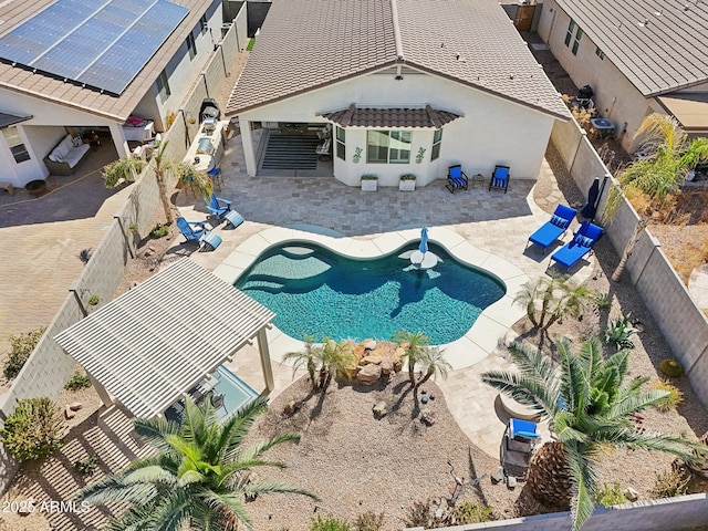 view of pool with a patio area, a fenced backyard, and a fenced in pool