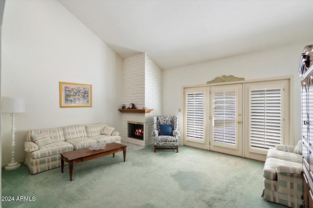 living room with a fireplace, vaulted ceiling, and carpet flooring