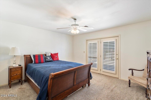 bedroom with light carpet, access to exterior, and ceiling fan