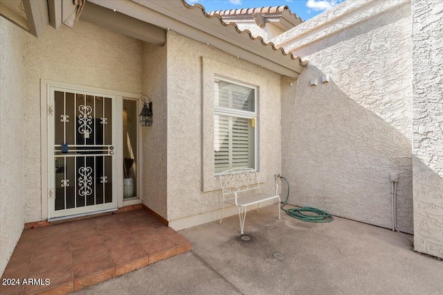 entrance to property with a patio