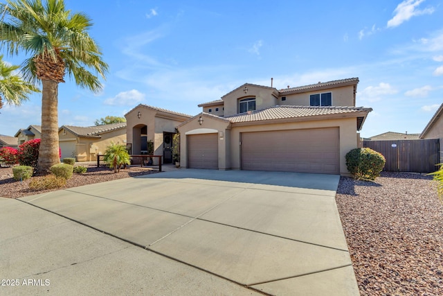 mediterranean / spanish-style home with a garage