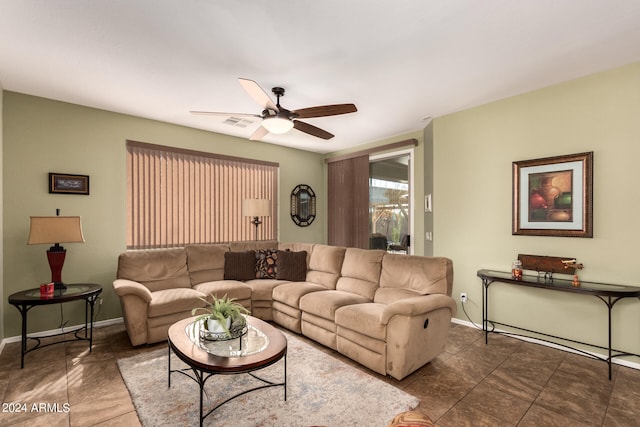 tiled living room featuring ceiling fan