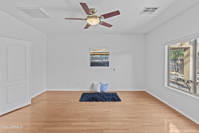 empty room featuring visible vents and light wood-style flooring