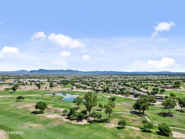 drone / aerial view featuring golf course view and a water and mountain view