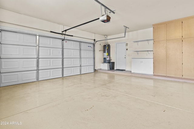 garage featuring a garage door opener and water heater