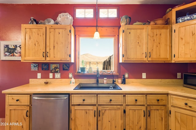 kitchen featuring pendant lighting, a mountain view, stainless steel appliances, and sink