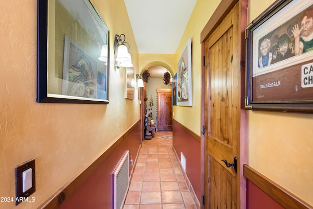 corridor with light tile patterned flooring