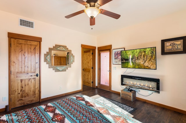 bedroom featuring dark wood-type flooring and ceiling fan