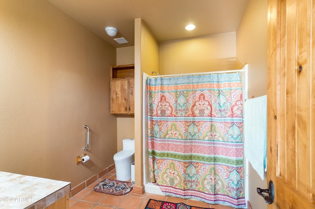 bathroom with tile patterned flooring, a shower with shower curtain, toilet, and vanity