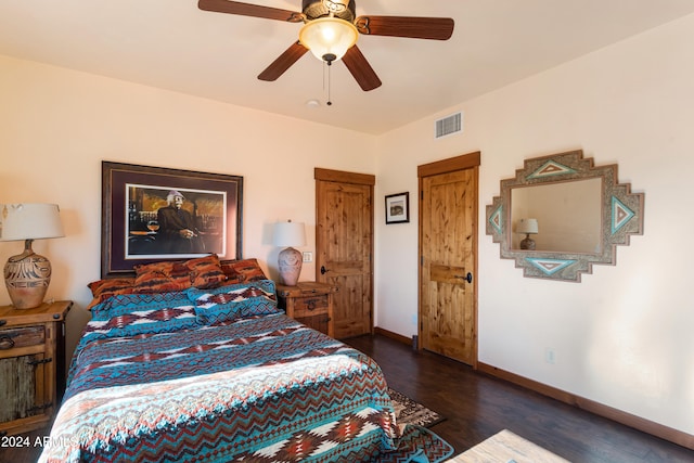 bedroom featuring dark hardwood / wood-style flooring and ceiling fan