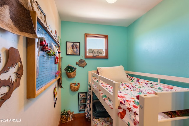 bedroom with hardwood / wood-style floors