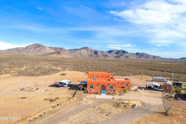 birds eye view of property with a mountain view