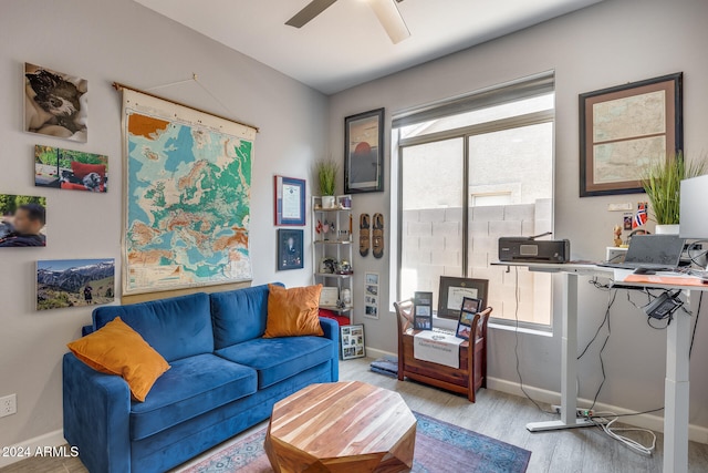 interior space with ceiling fan and light hardwood / wood-style flooring