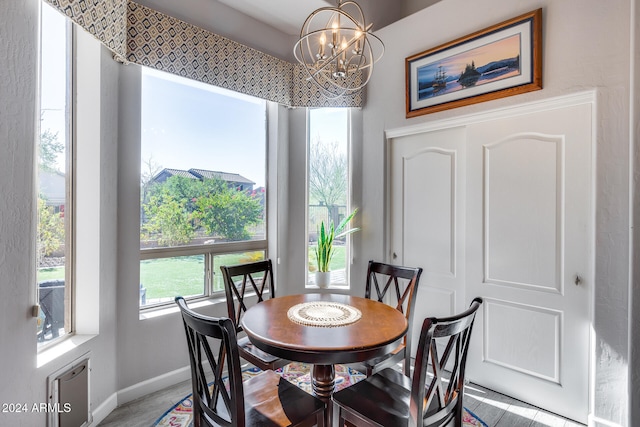 dining room featuring wood-type flooring and a notable chandelier