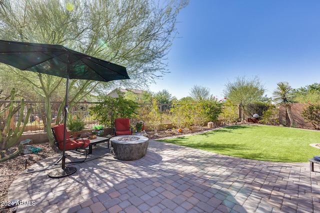 view of patio with a fire pit