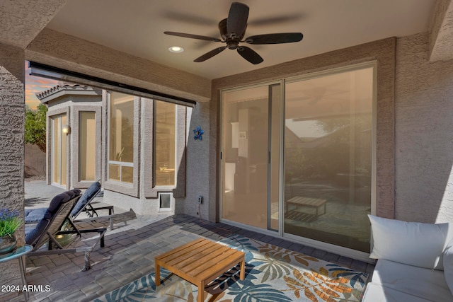 view of patio featuring ceiling fan