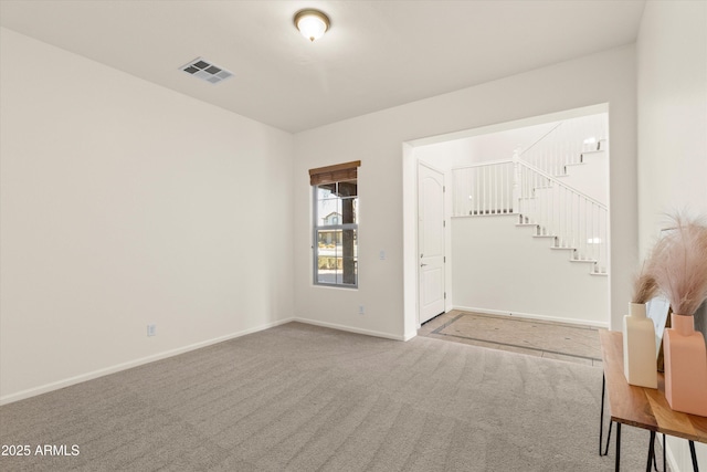 interior space featuring stairs, carpet, visible vents, and baseboards