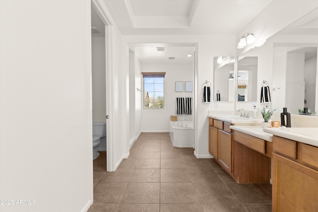 full bath with baseboards, toilet, tile patterned floors, a washtub, and vanity