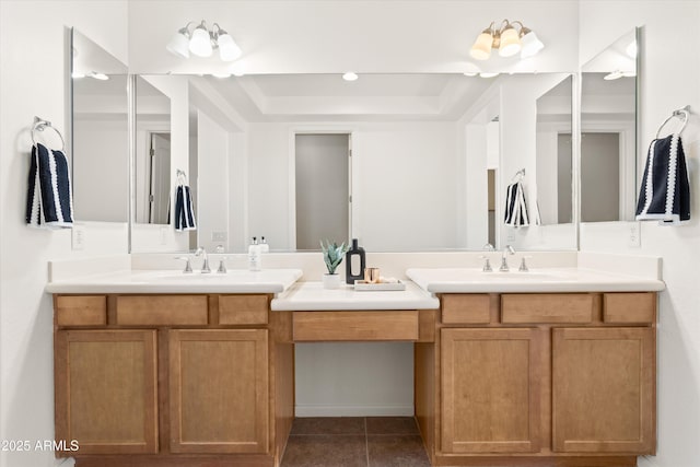 full bath featuring double vanity, tile patterned flooring, and a sink