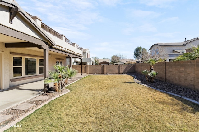 view of yard featuring a patio area and a fenced backyard