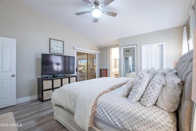 bedroom featuring ceiling fan, baseboards, vaulted ceiling, and wood finished floors