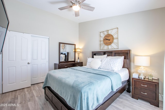 bedroom with ceiling fan, a closet, and light wood-type flooring