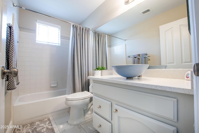 bathroom featuring visible vents, tile patterned flooring, vanity, toilet, and shower / bath combo