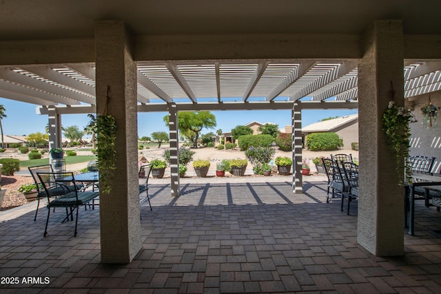 view of patio / terrace with a pergola and outdoor dining space