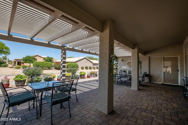 view of patio / terrace with a pergola and outdoor dining area