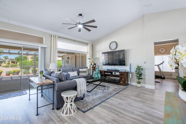 living room with a ceiling fan, baseboards, wood finished floors, and high vaulted ceiling