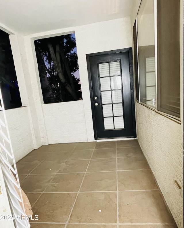 interior space with tile patterned floors