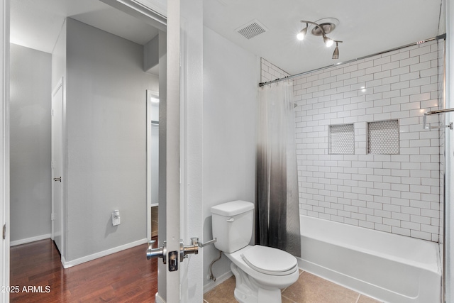 3302 N 7th St Unit 226, Phoenix, AZ 85014 - full bathroom featuring shower / tub combo and wood finished floors
