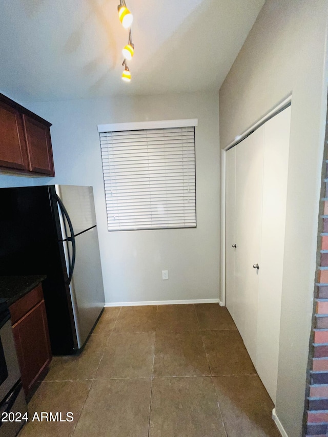 kitchen with stainless steel fridge and range