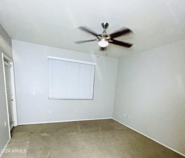 unfurnished bedroom with carpet flooring and ceiling fan