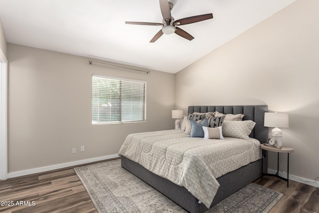 bedroom featuring ceiling fan, baseboards, vaulted ceiling, and wood finished floors