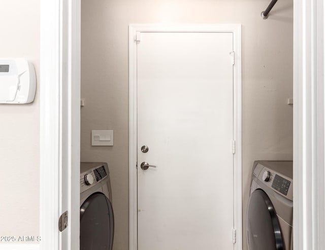 washroom featuring laundry area and washer / clothes dryer