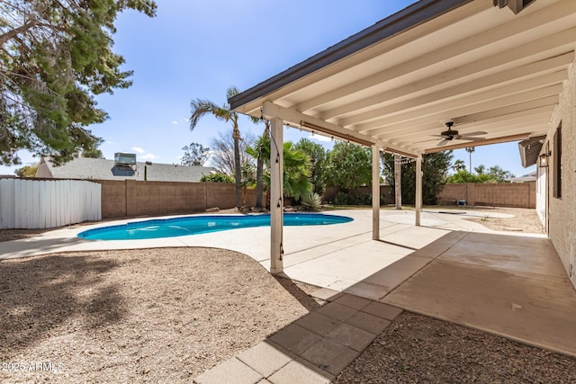 view of swimming pool featuring ceiling fan, a patio, a fenced backyard, and a fenced in pool