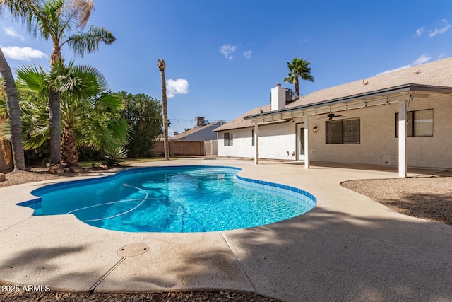 view of swimming pool with a fenced in pool, fence, and a patio