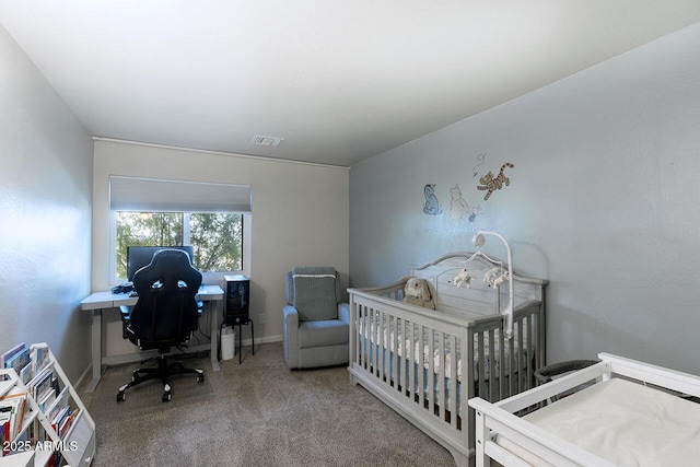 carpeted bedroom with a crib