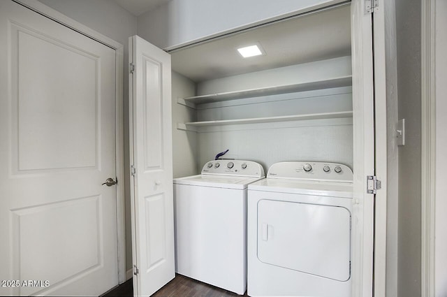 washroom with dark hardwood / wood-style floors and separate washer and dryer