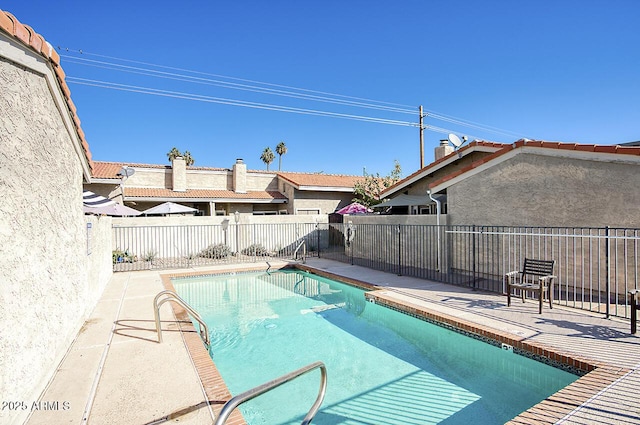 view of swimming pool featuring a patio