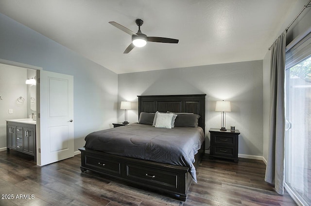 bedroom with connected bathroom, sink, dark hardwood / wood-style floors, and ceiling fan