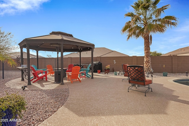 view of playground with a gazebo, a patio area, and a fire pit