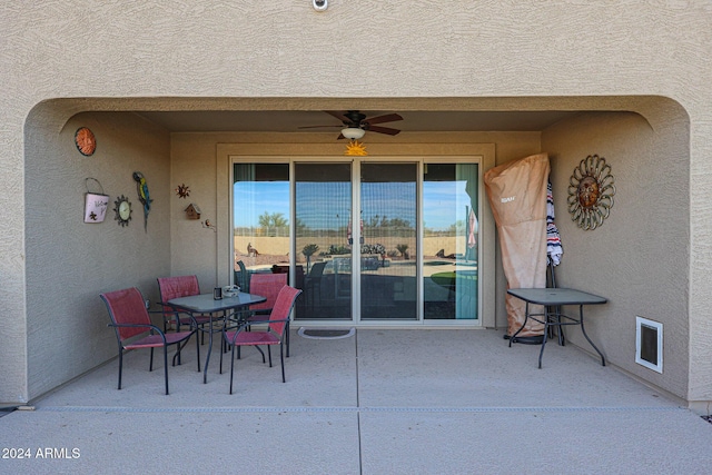 view of patio featuring ceiling fan