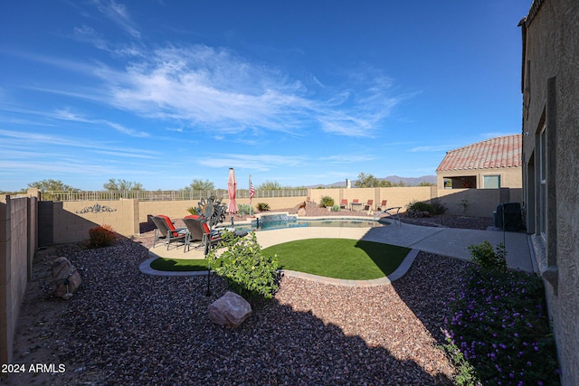 view of yard featuring a fenced in pool and a patio area